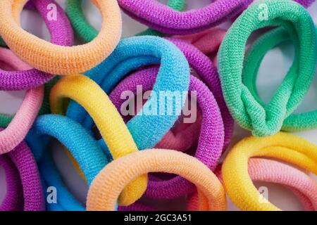 Closeup of various hair ties. Macro of multicolored elastics Stock Photo