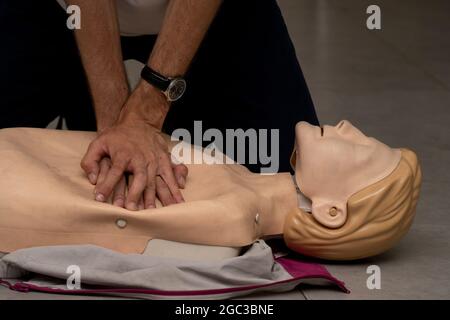 Tel Aviv, Israel - August 5th, 2021:Life support technique demonstrated on a CPR doll in a course in Tel Aviv, Israel. Stock Photo