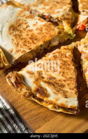 Homemade Carnitas Pork Cheesey Quesadilla with Tomato and Corn Stock Photo