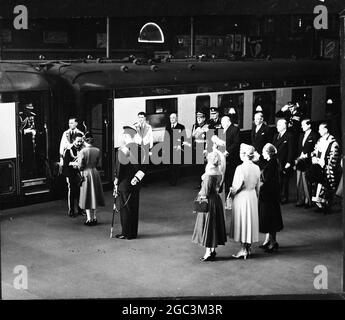 Royal Family Welcome Emperor Queen Elizabeth greeting Emperor Haile Selassie of Ethopia on his arrival at Victoria Station , on his three day state visit . Standing behind the Queen are the Duke of Edinburgh and the Ladies of the Royal Family , The Queen Mother Princess Margaret , The Princess Royal , and the Duchess of Gloucester . Background right are Prime Minister WInston Churchill , Foreign Minister Anthony Eden , Home Secretary Sir David Maxwell Fyfe and Viscount Alanbrooke 14th October 1954 Stock Photo