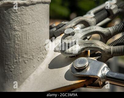 Detail of a boat turnbuckle for Wire Rope Sling. Steel turnbuckle, Fastening and Connections concept, Selective focus. Stock Photo