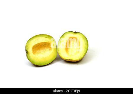 Galia melon whole and half piece composition isolated on white background Stock Photo
