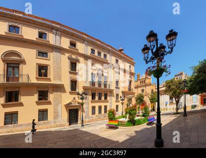 Castellon, Spain. June 14, 2021 - Panoramic of the lateral facade of the town hall, in the background the main square and the cathedral. Sculpture of Stock Photo