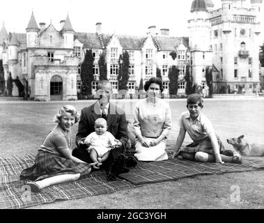 Sitting on a rug in the grounds of Balmoral Castle , Scotland , The Queen , Duke of Edinburgh , Prince Charles , Princess Anne and Prince Andrew , pose for a photograph . The Royal family is at present on holiday at Balmoral . 8 September 1960 Stock Photo