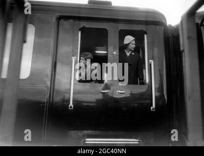 Portland, Dorset The Prince of Wales / Prince Charles takes a last look back from the train carriage window as with his mother Queen Elizabeth II they leave Portland Docks after a visit to the Aircraft Carrier HMS Eagle. 29 April 1959 Stock Photo