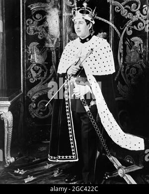 The official picture of Prince Charles, who will become the Prince of Wales, at a ceremony to be performed by Her Majesty Queen Elizabeth II at Caernarvon Castle, Wales on 1 July 1969. The Prince of Wales, pictured by Norman Parkinson at Windsor Castle, Berkshire is wearing his full regalia. Over a military uniform he wears an ermine robe. On his head is the Gold Coronet, weighing 3lbs and containing 75 diamonds and 12 emeralds. In one hand he carries the Gold Rod; in the other, the Sword of Office. 25 June 1969 Stock Photo
