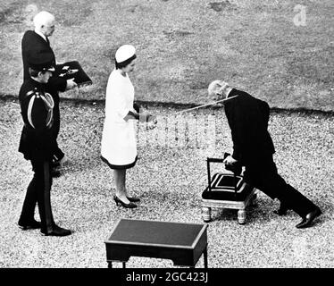 Arise Sir Francis! HM Elizabeth II dubs Sir Francis Chichester with the sword of Sir Francis Drake. He sailed single handed round the world. 7th July 1967 Stock Photo