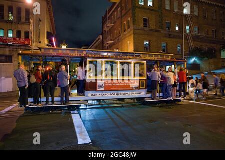 Cable car in Chinatown at night, San Francisco, California Stock Photo