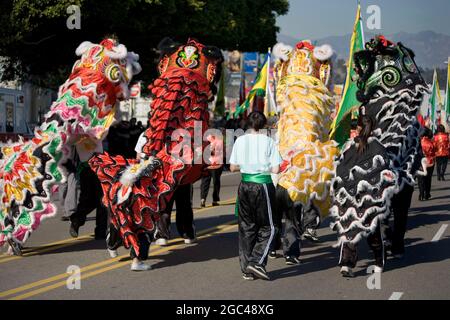 Group of Lion Dancers Perform in Chinese New Year Parade Stock Photo