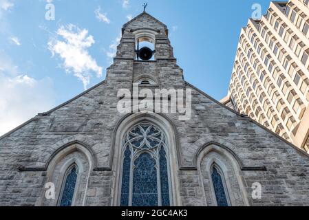 Low angle view of the Church of the Redeemer facade in Bloor Street in Toronto, Canada. The small church is a heritage place and a major tourist attra Stock Photo