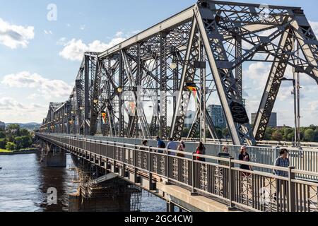 Ottawa, Canada - August 2, 2021: Alexandra Bridge between two provinces of Canada, from Ottawa, Ontario to Gatineau city of Quebec on sunny summer day Stock Photo