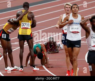 Tokyo, Kanto, Japan. 6th Aug, 2021. Joshua Cheptegei (UGA) wins the gold medal in the men's 5000m final and Paul Chelimo (USA), seen on ground, fell over the finish line to win the bronze medal during the Tokyo 2020 Olympic Summer Games at Olympic Stadium. (Credit Image: © David McIntyre/ZUMA Press Wire) Credit: ZUMA Press, Inc./Alamy Live News Stock Photo