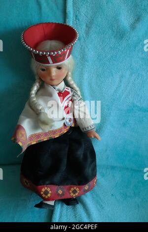 Plastic Latvian doll Aina Straume in a folk suit Stock Photo