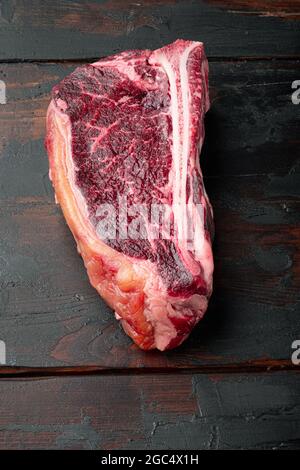 Dry aged club steak set, on old dark wooden table background Stock Photo