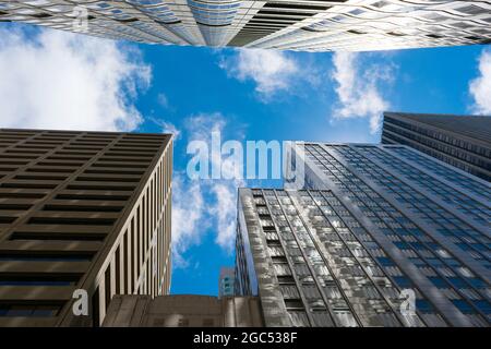 Looking up view between skyscrapers in financial district. Stock Photo