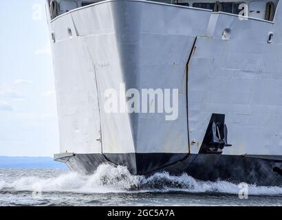 Closeup of the bow of a ferry boat cutting through the water. Stock Photo