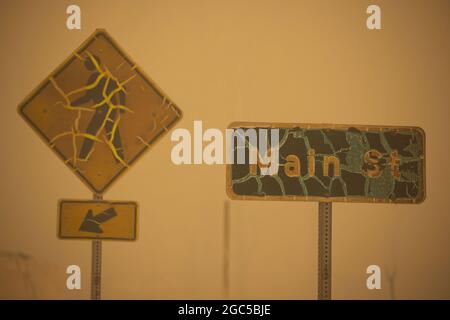 Greenville, USA. 06th Aug, 2021. Fire damaged road signs in the downtown area of Greenville, California after the Dixie fire destroyed the town, Friday August 6, 2021. Photo by Peter DaSilva/UPI Credit: UPI/Alamy Live News Stock Photo