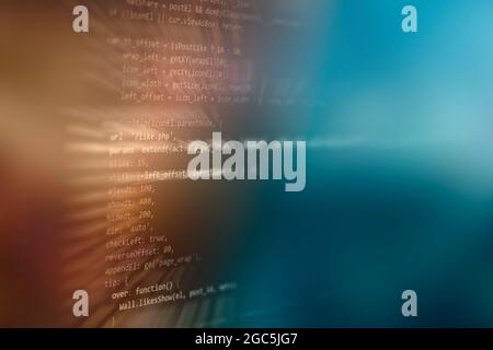 Digital tablet computer showing Stock Market index . Abstract IT technology background. Software source code. Stock Photo