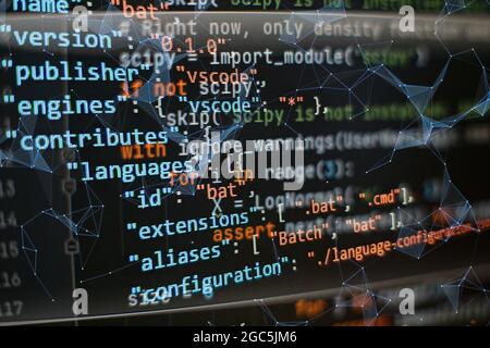 Website development. Developer working on program codes in office. Computer program. Programmer workplace. Programming code. Software source code. Stock Photo