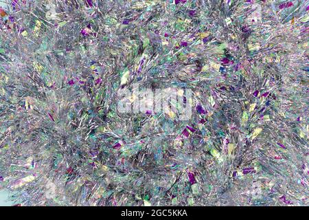 Christmas background with tinsel. Silvery background and beautiful bokeh. Stock Photo