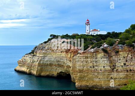 Lighthouse on the coast in Algarve, Portugal Stock Photo