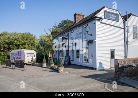 the tickled trout pub and ice cream van in the village of wye in kent Stock Photo