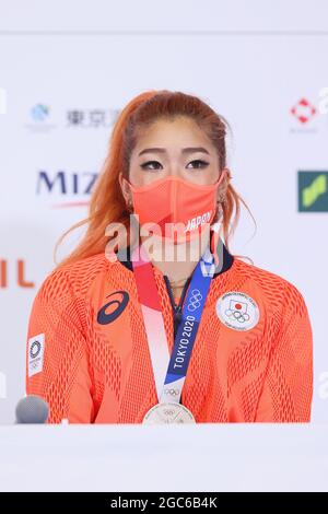 Silver medalist Miho Nonaka, of Japan, poses at the olympic podium