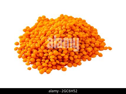Raw Organic Red Lentils grains on white background. Pile Raw Red Lentils isolated. Stock Photo