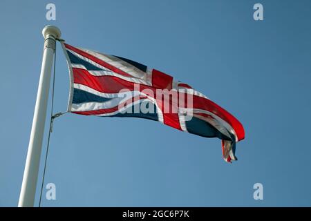 Union Jack, or Union Flag, of the United Kingdom of Great Britain flying in the breeze Stock Photo