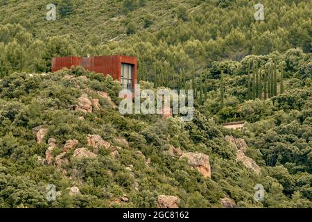 Iron house on the mountain surrounded by rock and trees in the village of Villafames, Castellon, Spain, Europe Stock Photo