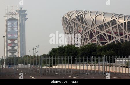 Beijing, China. 07th Aug, 2021. Roads are closed next to the 2008 Olympic Green, with the National Stadium (Bird's Nest) in the background, in Beijing, on Saturday, August 7, 2021. Pandemic and boycott fears are mounting six months ahead of the Beijing Winter Olympics in 2022. The Bird's Nest will be used for the closing ceremony. Photo by Stephen Shaver/UPI Credit: UPI/Alamy Live News Stock Photo