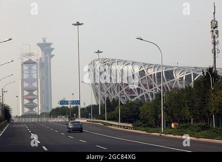 Beijing, China. 07th Aug, 2021. Roads are eerily empty next to the 2008 Olympic Green, with the National Stadium (Bird's Nest) in the background, in Beijing, on Saturday, August 7, 2021. Pandemic and boycott fears are mounting six months ahead of the Beijing Winter Olympics in 2022. The Bird's Nest will be used for the closing ceremony. Photo by Stephen Shaver/UPI Credit: UPI/Alamy Live News Stock Photo