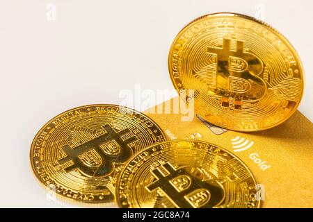 Golden bitcoin on credit cards. Business, money, cryptocurrency concept. Stock Photo