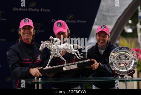 (left to right) Ladies team captain Hayley Turner, and jockeys Nicola Currie and Mickaelle Michel collecting the Dubai Duty Free Shergar Cup at Ascot Racecourse. Picture date: Saturday August 7, 2021. See PA story RACING Ascot. Photo credit should read: Steven Paston/PA Wire. RESTRICTIONS: Use subject to restrictions. Editorial use only, no commercial use without prior consent from rights holder. Stock Photo