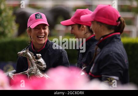 (left to right) Ladies team captain Hayley Turner, and jockeys Mickaelle Michel and Nicola Currie collecting the Dubai Duty Free Shergar Cup at Ascot Racecourse. Picture date: Saturday August 7, 2021. See PA story RACING Ascot. Photo credit should read: Steven Paston/PA Wire. RESTRICTIONS: Use subject to restrictions. Editorial use only, no commercial use without prior consent from rights holder. Stock Photo