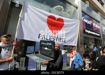 London, England, UK. 7th Aug, 2021. Protesters stage a protest against HP outside Curry's PC World store in Oxford Street.Boycott, DivestmentÂ andÂ Sanction (BDS)Â against Israel campaign activists walked through central London staging actions outside companies allegedly involved in occupation of Palestine. (Credit Image: © Tayfun Salci/ZUMA Press Wire) Stock Photo