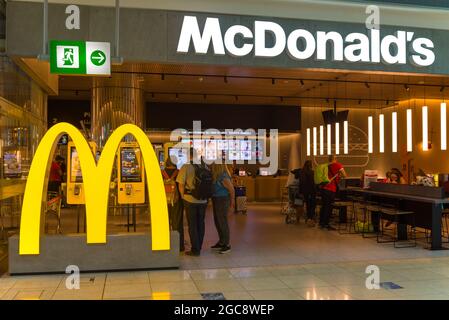 DUBAI, UAE - FEBRUARY 24, 2020: McDonald's fast food restaurant on the Dubai International Airport Stock Photo