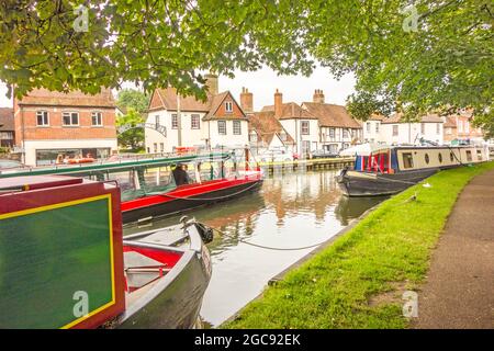 Kennet and Avon canal trust narrowboat passing through the Berkshire town of Newbury Stock Photo