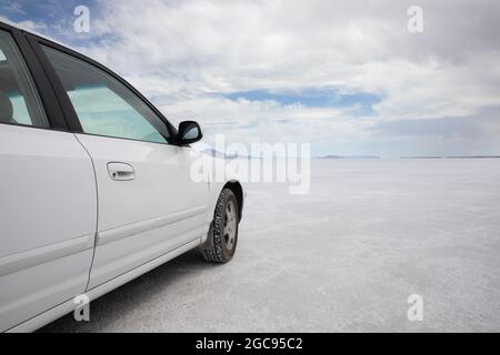 clouds in the backgroudn while driving on a white surface Stock Photo