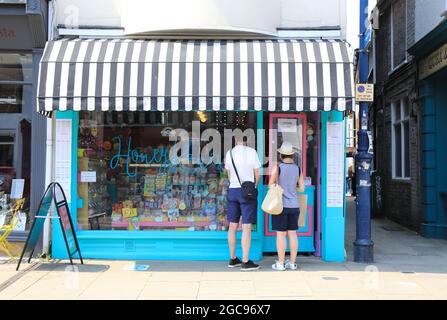 Independent shops on pretty Harbour Street, in coastal Whitstable, in north Kent, UK Stock Photo