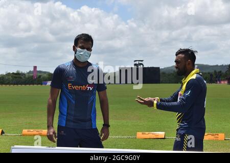 Sri Lankan cricketers Upul Tharanga and Ashan Priyanjan having a chat. The picturesque Army Ordinance cricket grounds. Dombagoda. Sri Lanka.