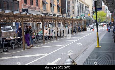New York, NY, USA - Aug 7, 2021: Outside dining on Broadway near 27th Street as street is closed to vehicular traffic