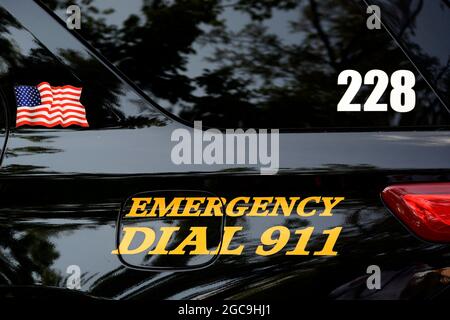 A police car with 'Dial 911' on its side in Santa Fe, New Mexico. Stock Photo