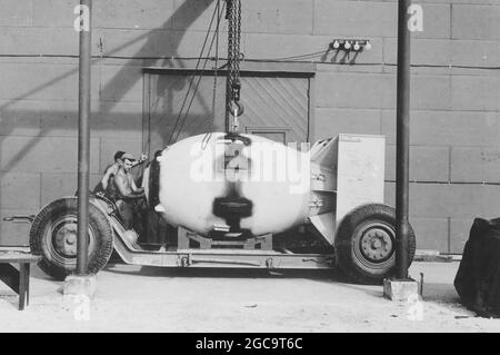 The atomic bomb Fat Man (dropped on Nagasaki) being placed on a trailer in 1945 Stock Photo