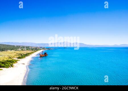 Rusty and abandoned shipwreck on a coastline near Gythio in Lakonia, Peloponnese Greece Stock Photo