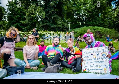 Amsterdam, Netherlands. 07th Aug, 2021. Protesters are seen posing for a photo during the demonstration.The annual equal rights demonstration for the global rainbow community took place in Amsterdam. Due to the COVID-19 measures, the demonstration didn't start at the Homo monument like each year, but at the Martin Luther King Park where there was more space for the thousands of participants. The march walked from the park, crossed the city center, and ended at the Amsterdam central station. Credit: SOPA Images Limited/Alamy Live News Stock Photo