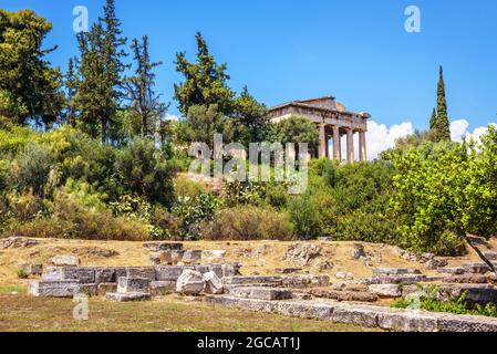 View of Greek Agora, Athens, Greece. Famous old Temple of Hephaestus, landmark of Athens in distance. Nice landscape with Ancient ruins in Athens city Stock Photo