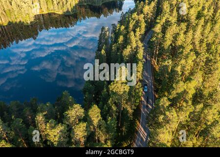 Aerial view of ridge road forest and lake in the morning Stock Photo