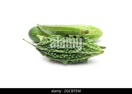 Bitter gourd, cucumber, and ladyfinger vegetables close up view on isolated white background