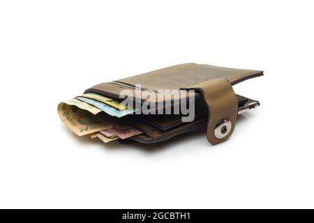 Old leather wallet with few bangladeshi banknotes on isolated white background Stock Photo